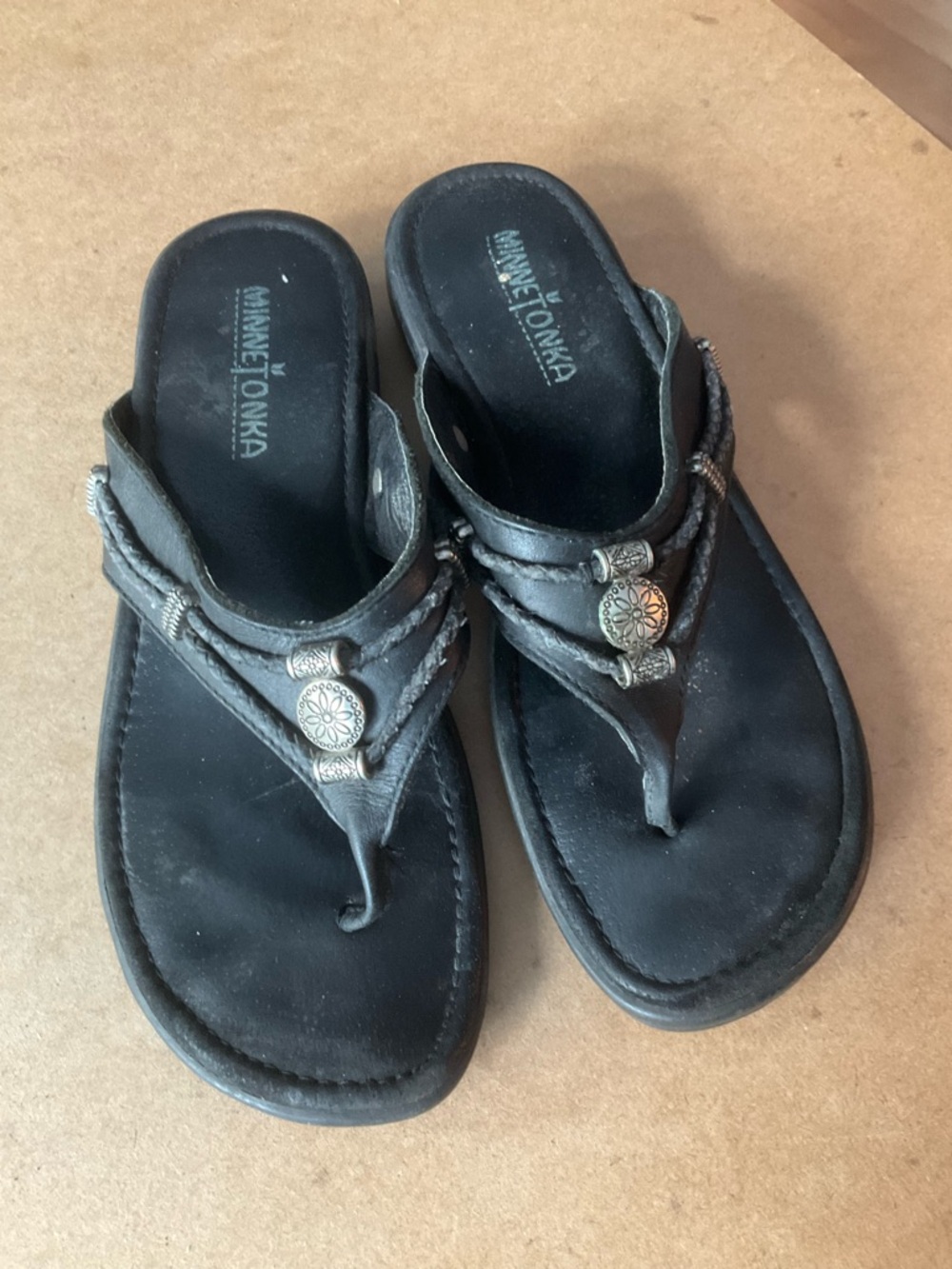 Minnetonka Black Braided T-Strap Sandals with Silver Conchos